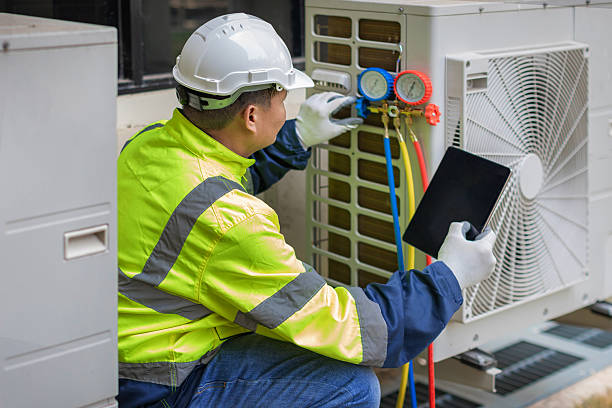 Professional Air Conditioning Repair technician working in Roggen, CO